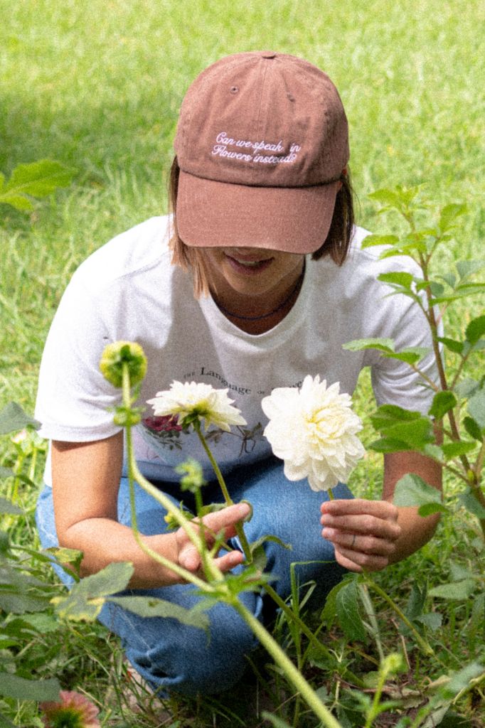 "Can we speak in flowers instead" Cap
