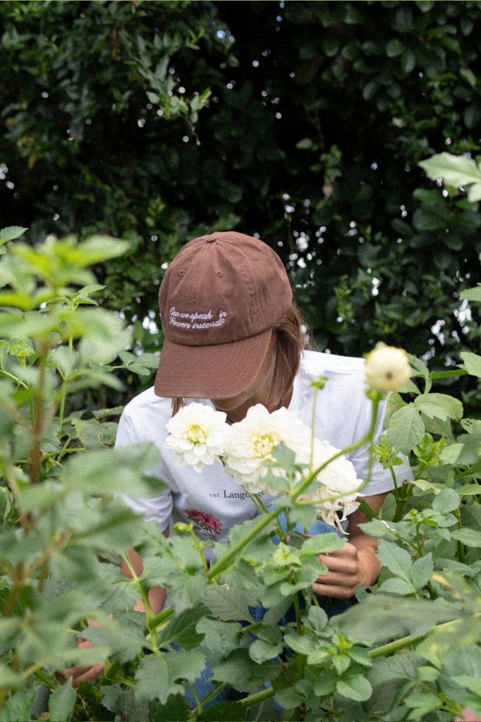 "Can we speak in flowers instead" Cap