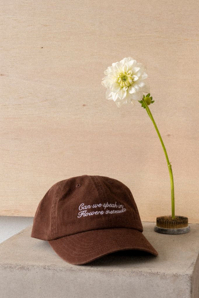 "Can we speak in flowers instead" Cap